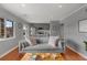 Bright living room with hardwood floors, gray walls, and view of outdoor patio at 1705 Monroe Ne Dr # D01, Atlanta, GA 30324