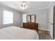 Comfortable bedroom with wood floors, natural light, and neutral walls at 1766 Sw Brewer Sw Blvd, Atlanta, GA 30310