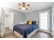 Bedroom featuring a ceiling fan, hardwood floors, and easy access to the backyard at 1766 Sw Brewer Sw Blvd, Atlanta, GA 30310