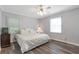 Bedroom featuring hardwood floors, neutral walls, and two bright windows at 1766 Sw Brewer Sw Blvd, Atlanta, GA 30310