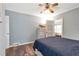 Bedroom featuring a ceiling fan, hardwood floors, and lots of natural light at 1766 Sw Brewer Sw Blvd, Atlanta, GA 30310
