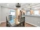 Dining room with hardwood floors, modern lighting, and a seamless transition to the kitchen at 1766 Sw Brewer Sw Blvd, Atlanta, GA 30310