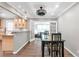 Dining room featuring hardwood floors, french doors, and an open layout connected to the kitchen at 1766 Sw Brewer Sw Blvd, Atlanta, GA 30310