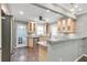 Charming kitchen with stainless steel appliances, granite countertops, and hardwood floors at 1766 Sw Brewer Sw Blvd, Atlanta, GA 30310