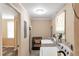 Functional laundry room with modern appliances and hardwood floors at 1766 Sw Brewer Sw Blvd, Atlanta, GA 30310