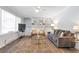Relaxing living room features a comfortable sofa, hardwood floors, and lots of natural light at 1766 Sw Brewer Sw Blvd, Atlanta, GA 30310
