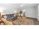 Welcoming living room featuring hardwood floors, comfortable seating, and an open floor plan at 1766 Sw Brewer Sw Blvd, Atlanta, GA 30310