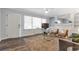 Inviting living room with hardwood floors, built-in shelving, and a cozy seating area at 1766 Sw Brewer Sw Blvd, Atlanta, GA 30310