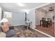 Open concept living room featuring hardwood floors and easy access to the dining room at 1766 Sw Brewer Sw Blvd, Atlanta, GA 30310
