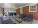 This screened porch is perfect for relaxing or entertaining, with ample seating and a cozy atmosphere at 1766 Sw Brewer Sw Blvd, Atlanta, GA 30310