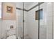 Modern bathroom shower with grey tile and glass doors at 1766 Sw Brewer Sw Blvd, Atlanta, GA 30310