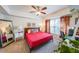 Cozy bedroom featuring a ceiling fan, a window with curtains, and a comfortable bed with stylish decor at 200 River Vista Dr # 236, Atlanta, GA 30339