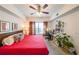 Inviting bedroom with natural light, a ceiling fan, comfortable bed, and a dedicated workspace with a desk at 200 River Vista Dr # 236, Atlanta, GA 30339