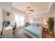 Comfortable bedroom with a ceiling fan, ample lighting, and stylish decorations at 200 River Vista Dr # 236, Atlanta, GA 30339