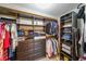 Spacious walk-in closet with shelving, hanging rods, and dresser, offering ample storage at 200 River Vista Dr # 236, Atlanta, GA 30339