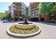 Attractive landscaping and flower beds surround this gorgeous condominium community and entry fountain at 200 River Vista Dr # 236, Atlanta, GA 30339