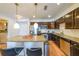 Modern kitchen with granite countertops, stainless steel appliances and a kitchen island with bar stool seating at 200 River Vista Dr # 236, Atlanta, GA 30339