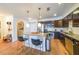 Well-equipped kitchen featuring stainless steel appliances, granite countertops, subway tile backsplash, and an island with seating at 200 River Vista Dr # 236, Atlanta, GA 30339