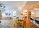 Stylish living room with hardwood floors, a modern chandelier, a dining area, and an open layout to the kitchen at 200 River Vista Dr # 236, Atlanta, GA 30339