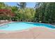 Inviting swimming pool surrounded by lounge chairs and greenery, perfect for relaxation at 200 River Vista Dr # 236, Atlanta, GA 30339