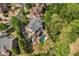 A tranquil estate is surrounded by lush trees, ensuring privacy in this beautiful neighborhood at 3215 Oxleas Ct, Cumming, GA 30041