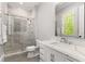 Modern bathroom with marble shower, quartz countertop, and stylish fixtures at 3215 Oxleas Ct, Cumming, GA 30041
