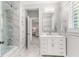 Bathroom featuring a marble shower, tile floors, and white vanity at 3215 Oxleas Ct, Cumming, GA 30041