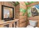 Themed bathroom with nature artwork, unique vanity and custom cabinet at 3215 Oxleas Ct, Cumming, GA 30041