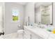 Bathroom with white marble countertop and shower with a view to another bedroom at 3215 Oxleas Ct, Cumming, GA 30041