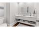 Modern half bathroom with sleek vanity, illuminated mirror, and stylish decor at 3215 Oxleas Ct, Cumming, GA 30041