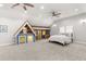 A bonus room showcasing a whimsical playhouse and neutral tones at 3215 Oxleas Ct, Cumming, GA 30041