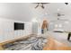 Spacious bonus room with a built-in entertainment center, playhouse, and sitting area at 3215 Oxleas Ct, Cumming, GA 30041