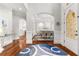 Grand foyer showcasing hardwood floors, archways, and an elegant dining room at 3215 Oxleas Ct, Cumming, GA 30041