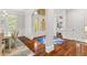 Open-concept foyer with hardwood floors and views to the dining and office spaces at 3215 Oxleas Ct, Cumming, GA 30041