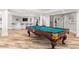 Game room with billiard table and large windows overlooking backyard at 3215 Oxleas Ct, Cumming, GA 30041
