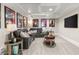 Inviting media room with plush seating and a large screen TV at 3215 Oxleas Ct, Cumming, GA 30041