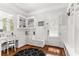 Well-lit home office with custom built-ins, desk space, and natural light at 3215 Oxleas Ct, Cumming, GA 30041