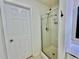 Clean bathroom showcasing a glass-enclosed shower, white tiled walls, and well-maintained hardware at 365 Friars Head Dr, Suwanee, GA 30024