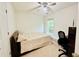 Comfortable bedroom with neutral tones, natural light, and a cozy bed with white bedding at 365 Friars Head Dr, Suwanee, GA 30024