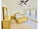 Bedroom with neutral carpet, ceiling fan and a sunny window view at 365 Friars Head Dr, Suwanee, GA 30024