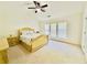 Bedroom with neutral carpet and sunny window view with ceiling fan at 365 Friars Head Dr, Suwanee, GA 30024