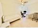 Well-organized bedroom with a cozy bed, natural light, and a functional workspace at 365 Friars Head Dr, Suwanee, GA 30024