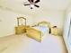Bedroom with neutral carpet and yellow wood bedroom set at 365 Friars Head Dr, Suwanee, GA 30024