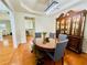 Dining area showcasing hardwood floors, a modern light fixture, and stylish furnishings at 365 Friars Head Dr, Suwanee, GA 30024