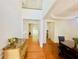 Bright foyer with hardwood floors, a high ceiling, and a view into adjoining rooms at 365 Friars Head Dr, Suwanee, GA 30024