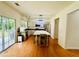 Spacious kitchen featuring modern appliances, an island with seating, and sliding glass doors to the backyard at 365 Friars Head Dr, Suwanee, GA 30024