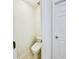 Small toilet room in white with toilet and door at 365 Friars Head Dr, Suwanee, GA 30024