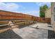 This backyard is tiered and features wooden retaining walls and paving stones at 4044 Elsdon Dr, Austell, GA 30106