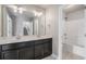 This bathroom features a double vanity and a shower-tub combination at 4044 Elsdon Dr, Austell, GA 30106