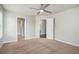 The carpeted bedroom features two doors and neutral-colored walls at 4044 Elsdon Dr, Austell, GA 30106